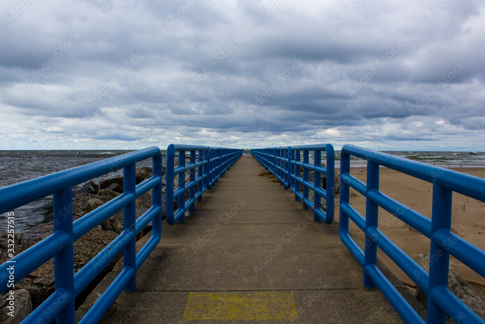 Fototapeta premium Metal bridge trail path in park symmetric