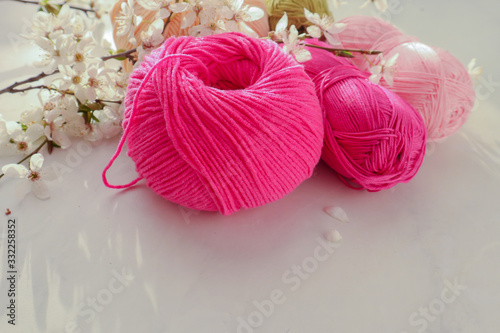 Colorful cotton yarn balls on light background