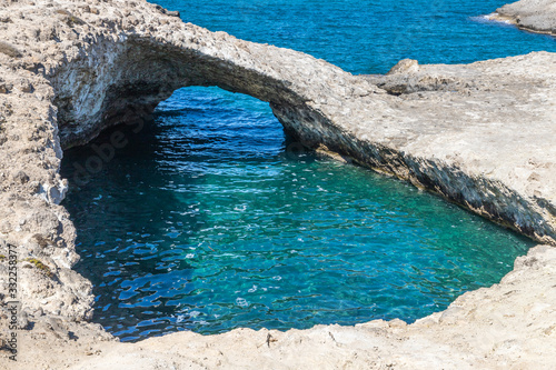 Cliffs, cave and ocean in Papafragas beach photo