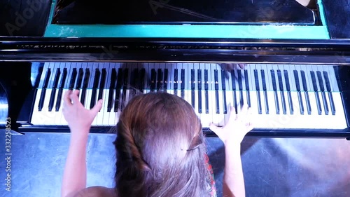 woman plays piano red october photo