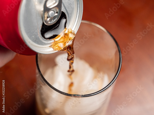 Soda Can Pouring into Glass