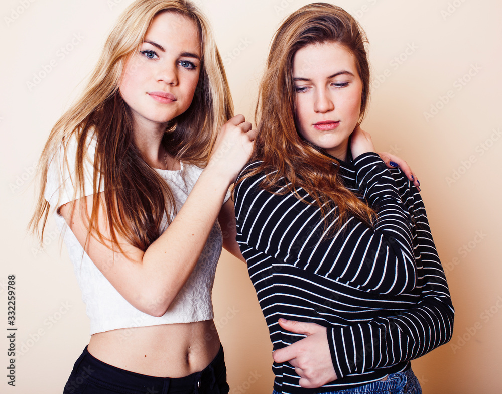 best friends teenage girls together having fun, posing emotional on white background, besties happy smiling, lifestyle people concept closeup. making selfie best friends teenage girls together having fun, posing emotional on white background, besties happy smiling, lifestyle people concept closeup. making selfie