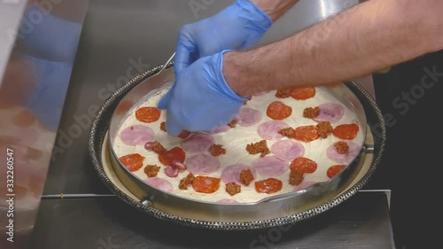 chef making pizza at kitchen photo