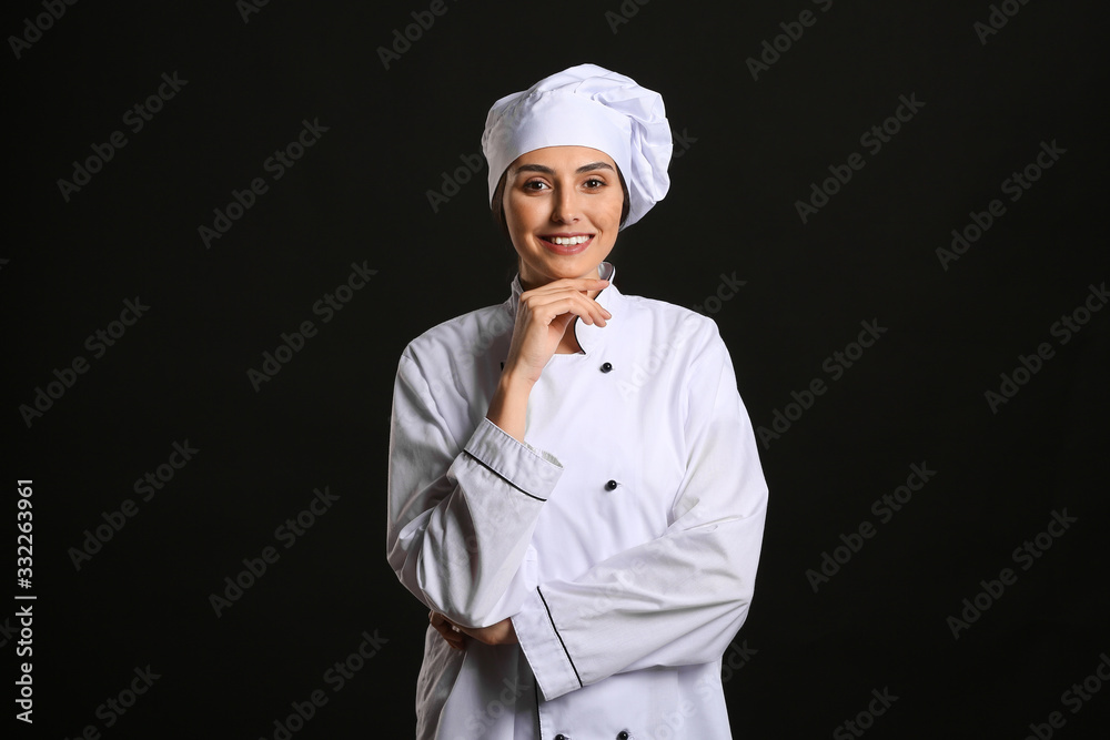 Portrait of female chef on dark background Portrait of female chef on dark background