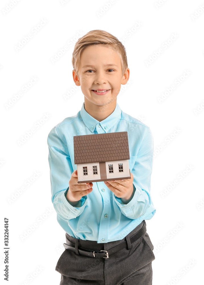 Portrait of little real estate agent with model of house on white background Portrait of little real estate agent with model of house on white background