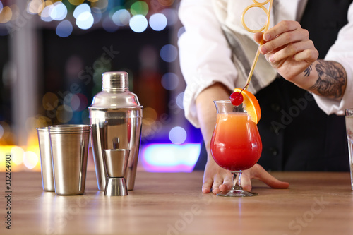 Female bartender making coc...