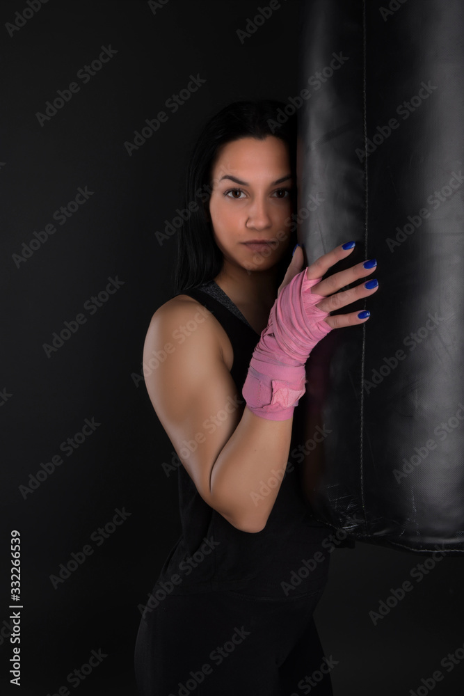 sexy girl training in the gym engaged in boxing