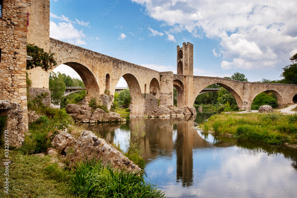 Old bridge over the river Fluvia in medieval town of Besalu, province Girona, Spain