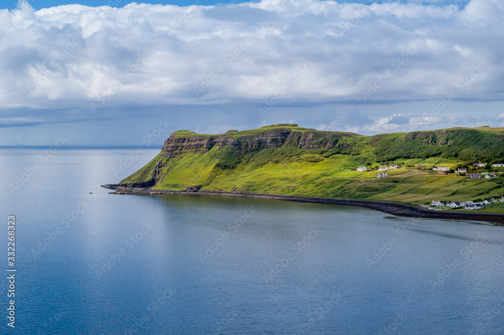 Obraz premium Hebrides islands cape and scottish village under the hills. Island of Skye, Scotland.