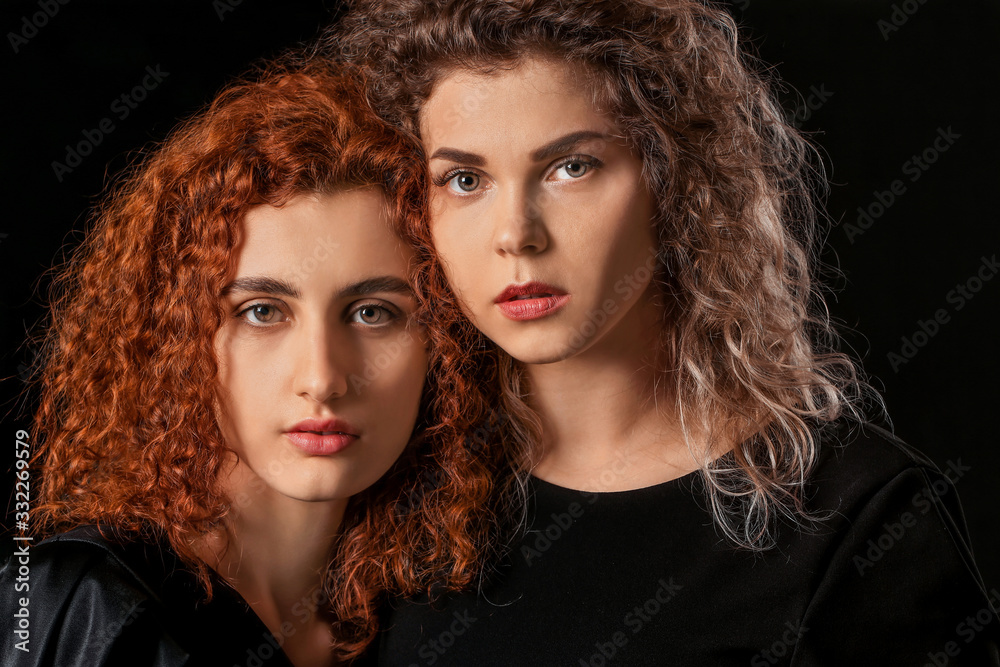 Beautiful young women on dark background