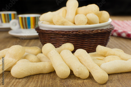 Traditional Brazilian starch biscuit called biscoito de polvilho in a wood background coffe table photo