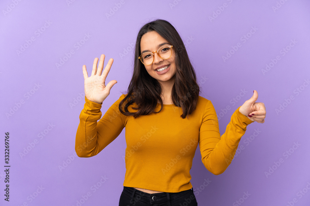 Young mixed race woman isolated on purple background counting six with fingers Young mixed race woman isolated on purple background counting six with fingers