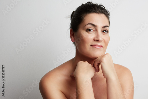 Close-up portrait of attractive beautiful woman posing in the studio. 