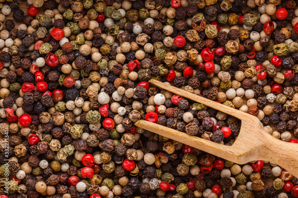 mix of peppercorns on white acrylic background mix of peppercorns on white acrylic background