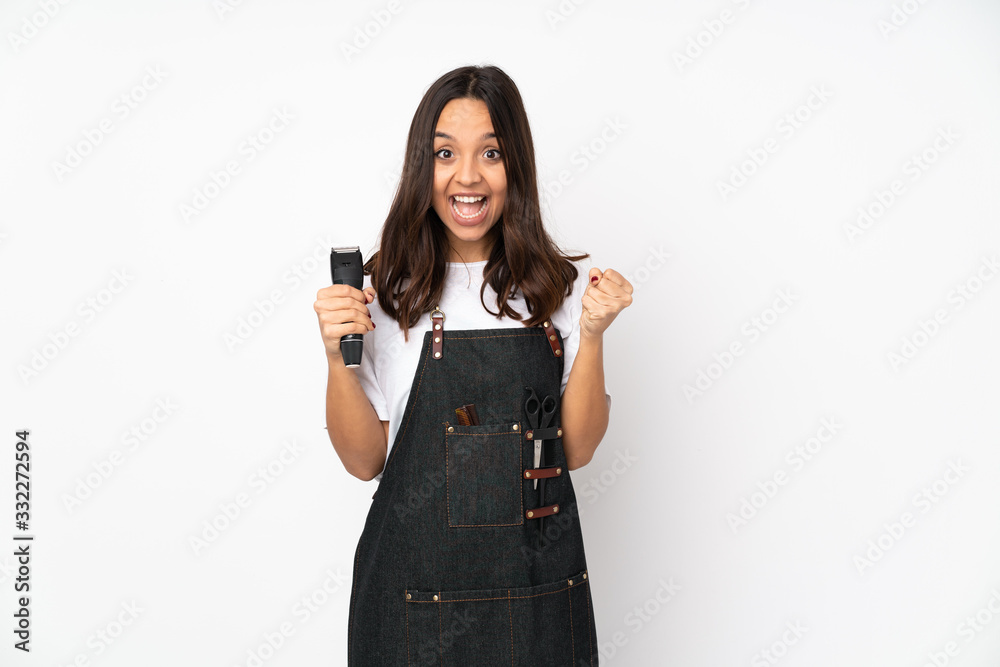 Young hairdresser woman isolated on white background celebrating a victory in winner position Young hairdresser woman isolated on white background celebrating a victory in winner position