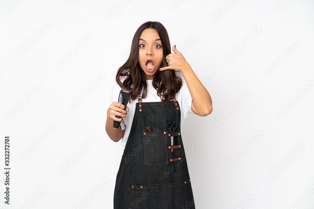 Young hairdresser woman isolated on white background making phone gesture and doubting Young hairdresser woman isolated on white background making phone gesture and doubting