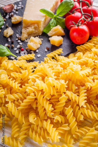 concept of traditional italian pasta with tomatoes and basil