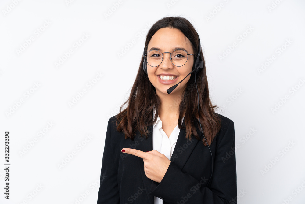 Young telemarketer woman isolated on white background surprised and pointing side Young telemarketer woman isolated on white background surprised and pointing side