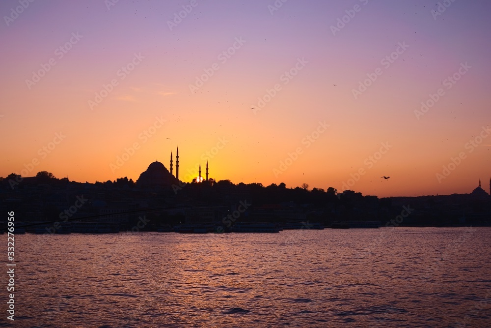 Hagia Sophia, the most important tourist attraction of Istanbul, Turkey, silhouetted against the twilight sky from across the Bosphorus.
