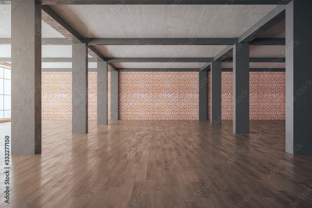 Modern brick interior with columns and blank wall.