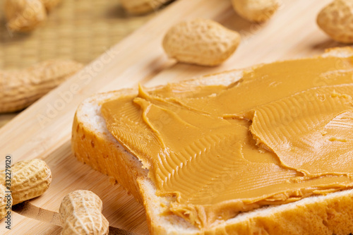 Delicious peanut butter sandwich on a wooden background