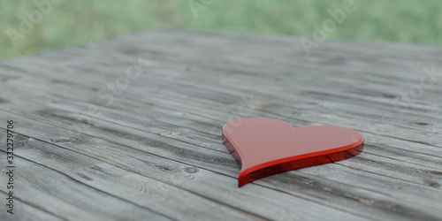 glossy shiny red stone heart on wooden background in sun dawn lighting concept for love 3d illustration render