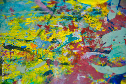 abstract paint marks on concrete, yellow, red, cyan, green, purple, fuchsia