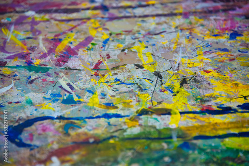 abstract paint marks on concrete, yellow, red, cyan, green, purple, fuchsia