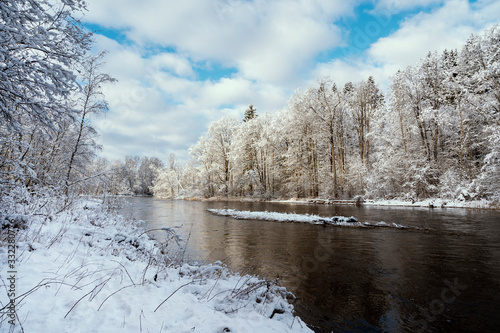 River Gauja at Baltic states during winter with deep snow and blue skies.