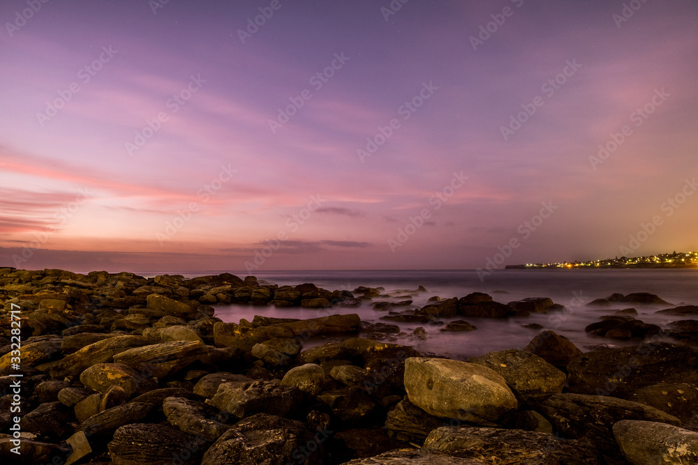 rocks by the sea at sunrise