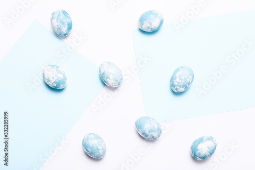 Happy Easter background. Easter eggs on white background, top view