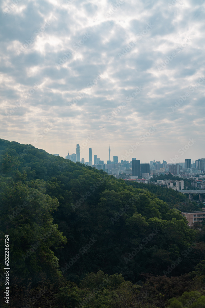 Taking photos of Guangzhou downtown at the top of Baiyun Mountain