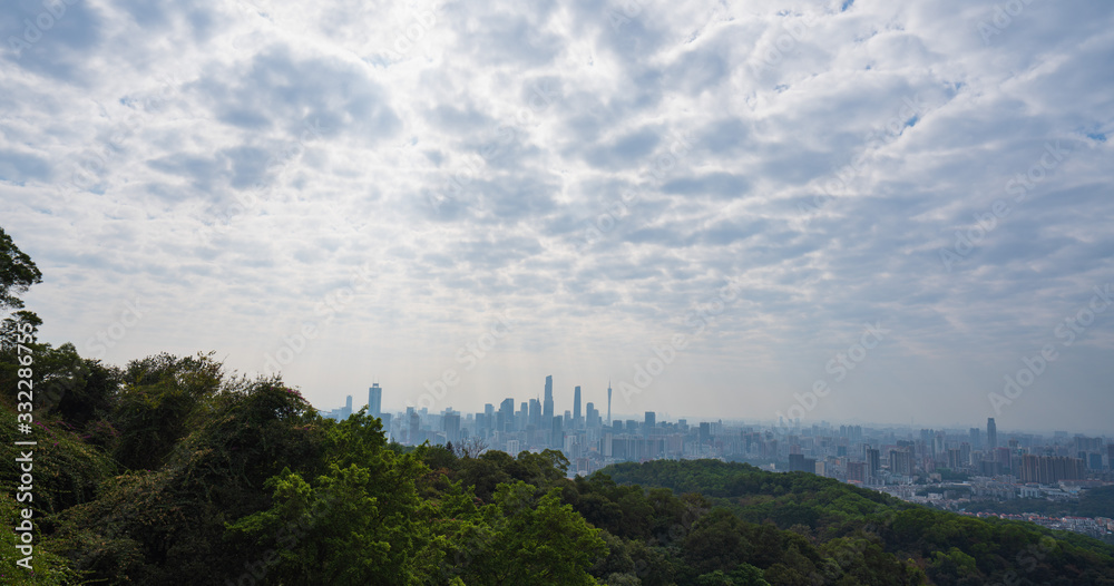 Taking photos of Guangzhou downtown at the top of Baiyun Mountain