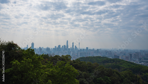 Taking photos of Guangzhou downtown at the top of Baiyun Mountain