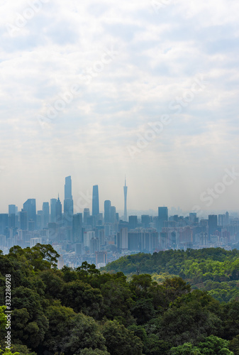 Taking photos of Guangzhou downtown at the top of Baiyun Mountain