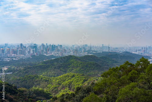 Taking photos of Guangzhou downtown at the top of Baiyun Mountain