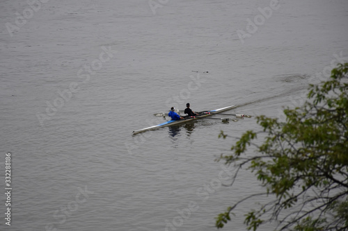 Two rowing kayaks sail across the Danube