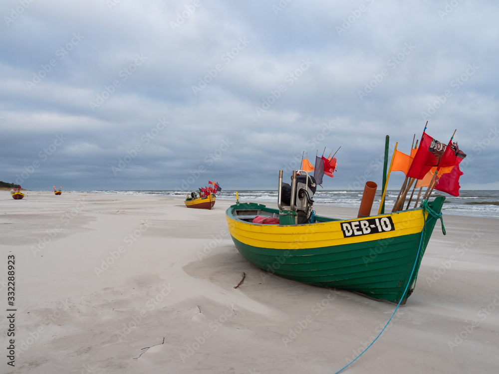 Debki beach, colorful fishing boats at the seashore. Poland