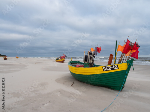 Debki beach, colorful fishing boats at the seashore. Poland