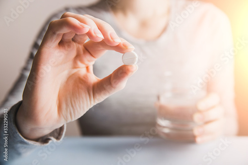 Woman drink pills in morning
