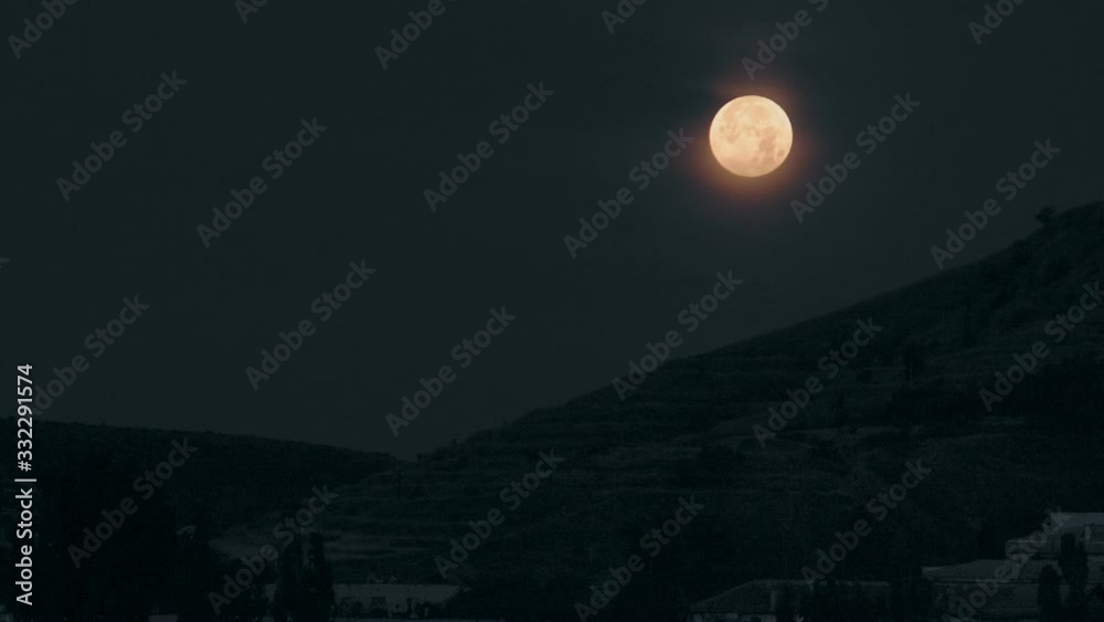 Full moon over the mountain at night Full moon over the mountain at night