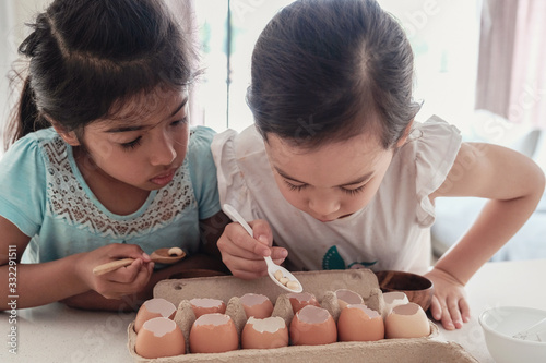 Bilde på lerret young mixed race multiethnic children planting seedlings in reuse eggshells, mon