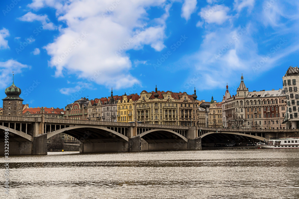 panorama to the old part of the city famous building of Prague dancing house two cylindrical towers symbol of a dancing couple  on the bank of the river of Vaclav