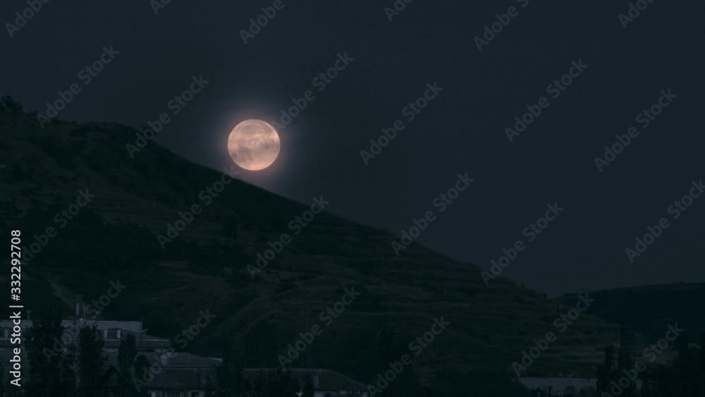 Full moon over the big mountain at night Full moon over the big mountain at night