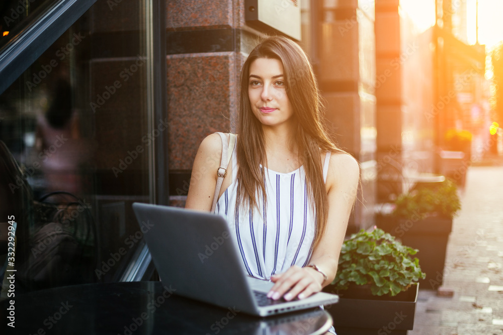 Young pretty woman in street cafe with tablet laptop Young pretty woman in street cafe with tablet laptop