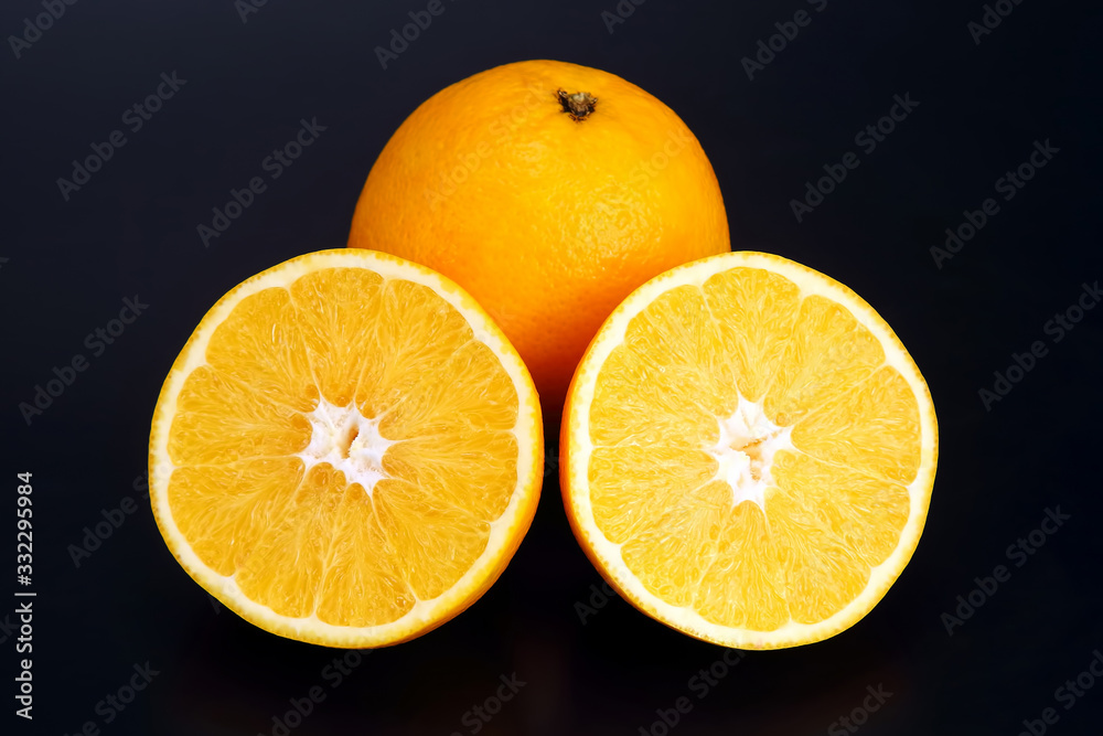 Citrus fruit sliced orange fruit on a dark background Citrus fruit sliced orange fruit on a dark background