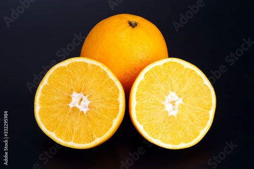 Citrus fruit sliced orange fruit on a dark background