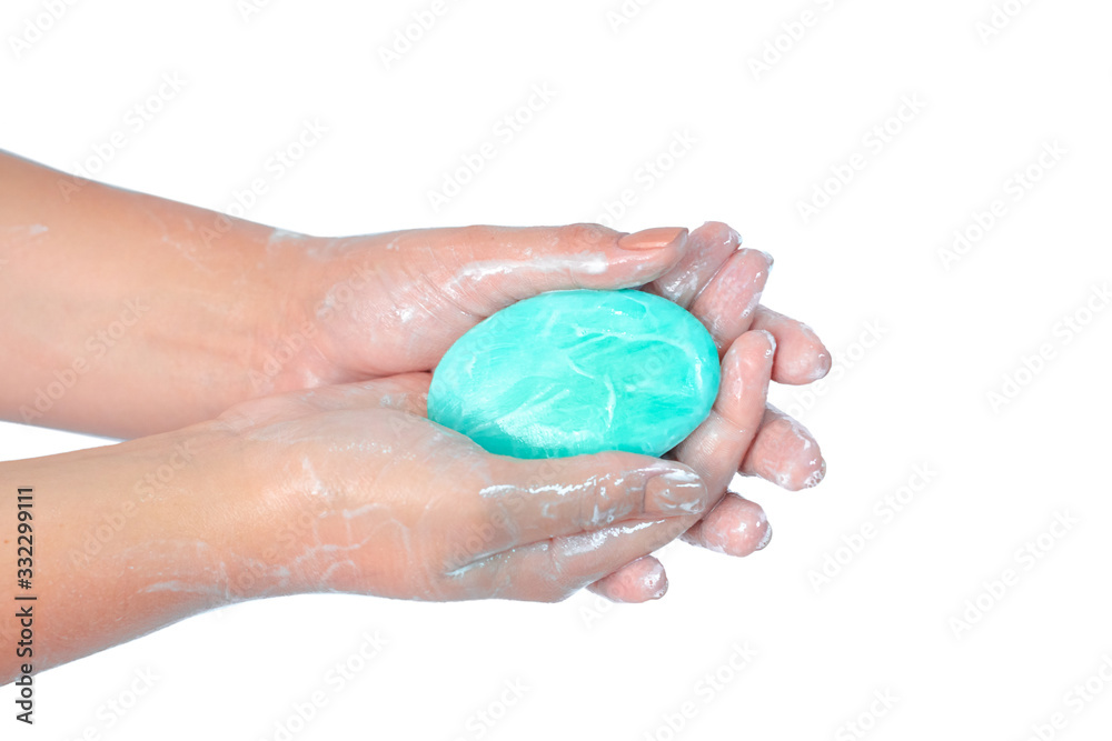 Close up of washing hands with soap with red corona virus isolated on white background. Coronavirus prevention hand hygiene. Corona Virus pandemic protection by cleaning hands frequently. Close up of washing hands with soap with red corona virus isolated on white background. Coronavirus prevention hand hygiene. Corona Virus pandemic protection by cleaning hands frequently.
