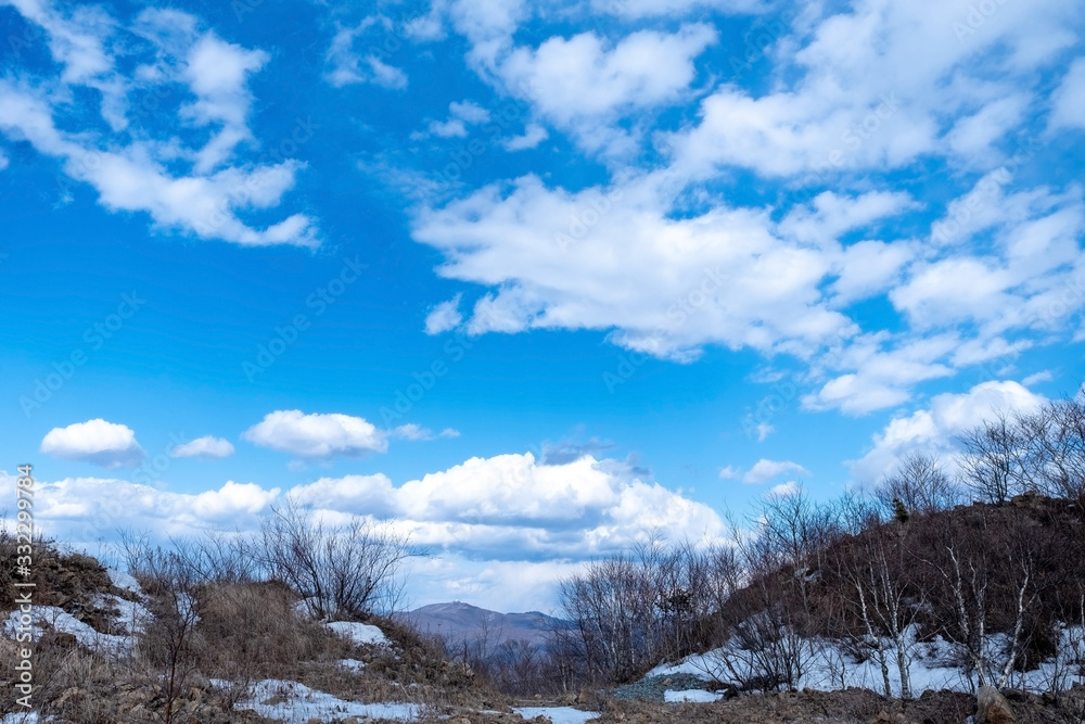 Beautiful blue sky, white clouds in the mountains