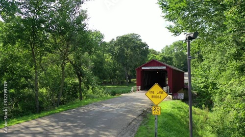 Approaching Small One Lane Wooden Covered bridge, Dolly forward, Princeton, Illinois photo